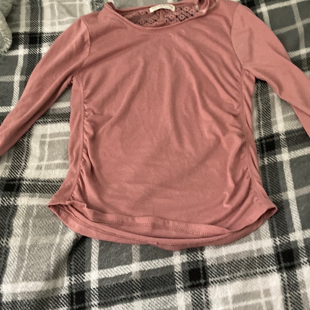 Pink small kids shirt with flowers in the back